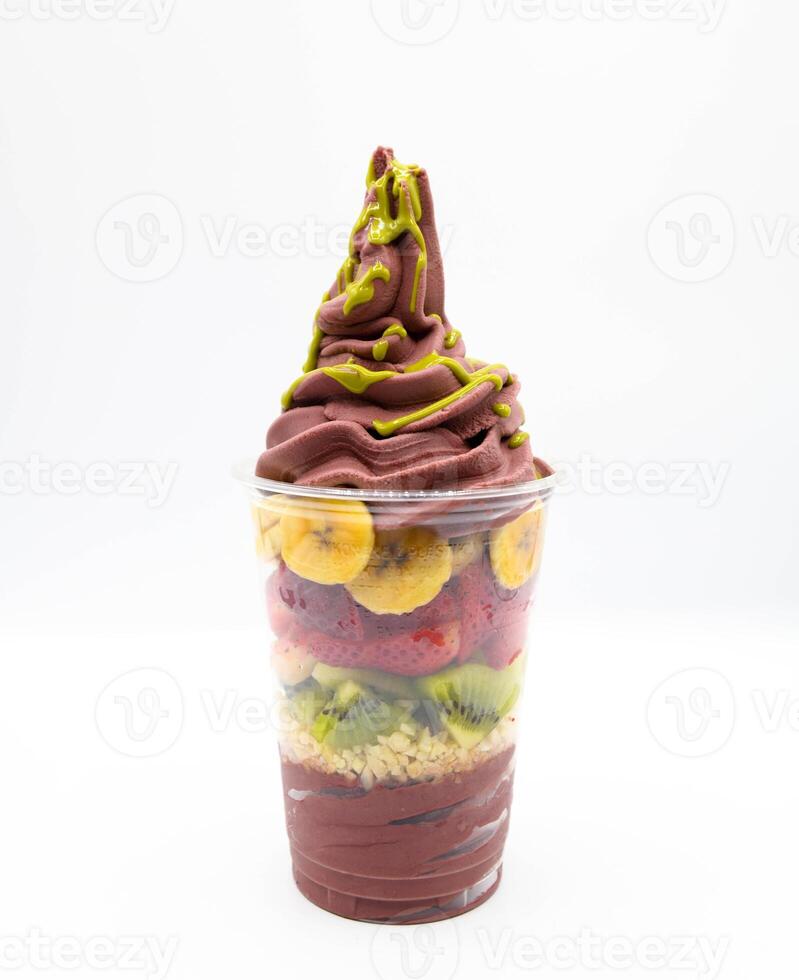 Yogurt and acai ice cream with chopped fruit pieces photo