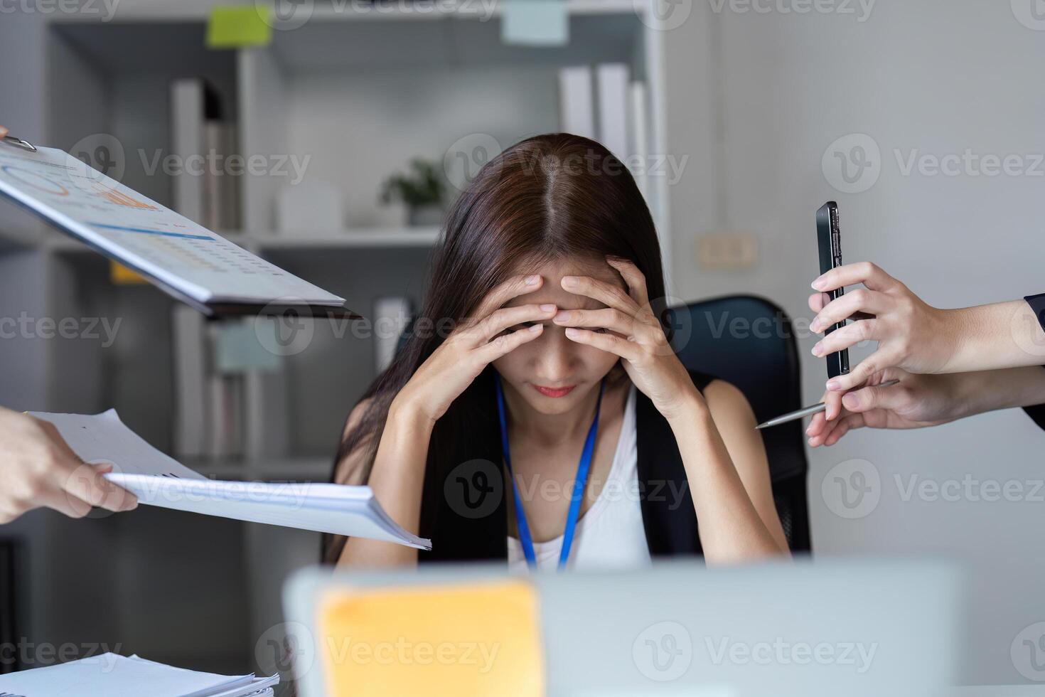 Focused Businesswoman Managing Work Documents in a Modern Office Setting photo