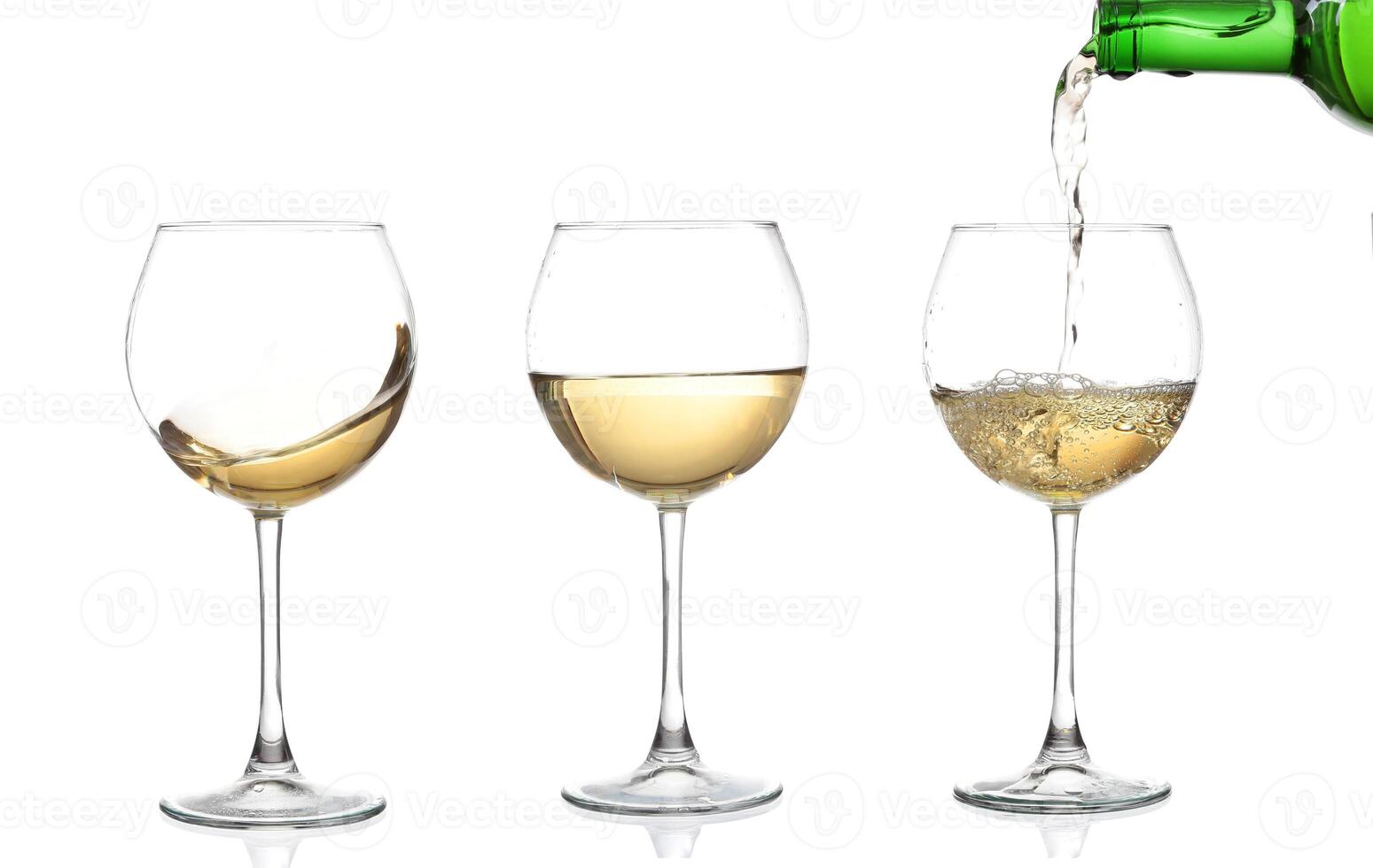 WHITE wine swirling in a goblet wine glass, isolated on a white background photo