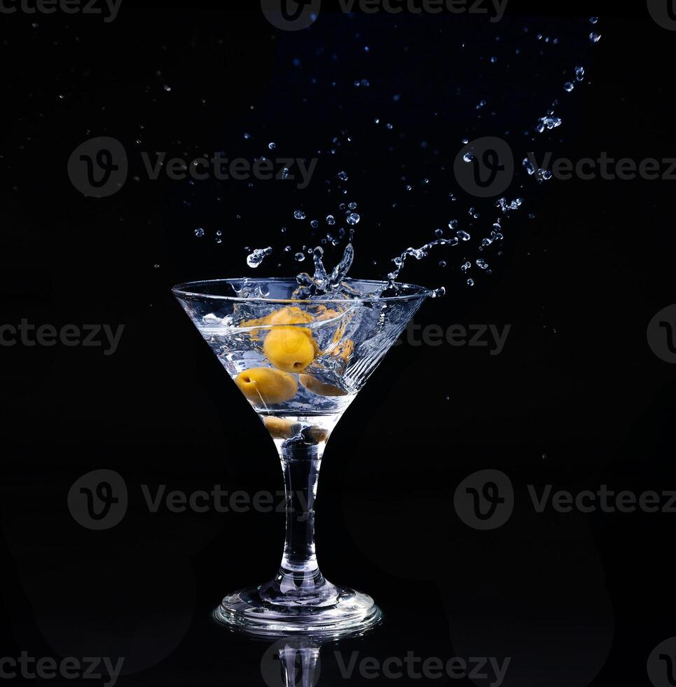 Vermouth cocktail inside martini glass over dark background photo