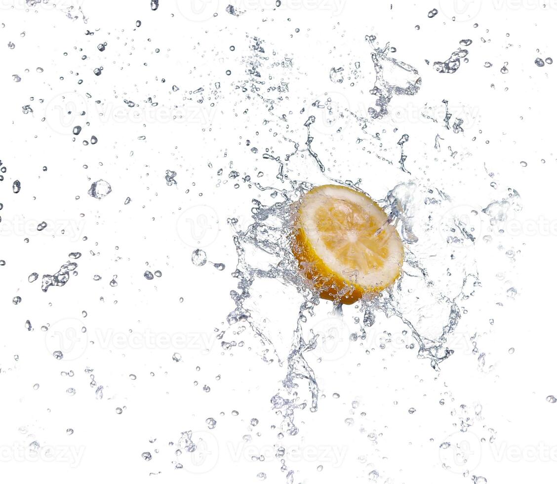 segment of lemon falling in to the water and making splash photo