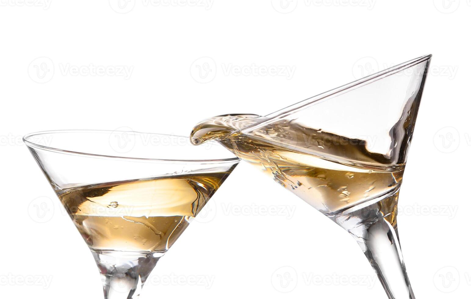 two wine swirling in a goblet martini glass, isolated on a white background photo
