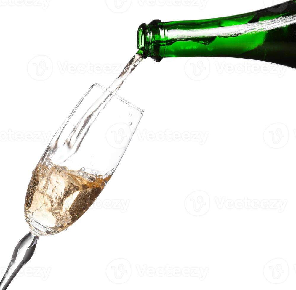 Champagne being poured into glass or flute, isolated on a white background. photo