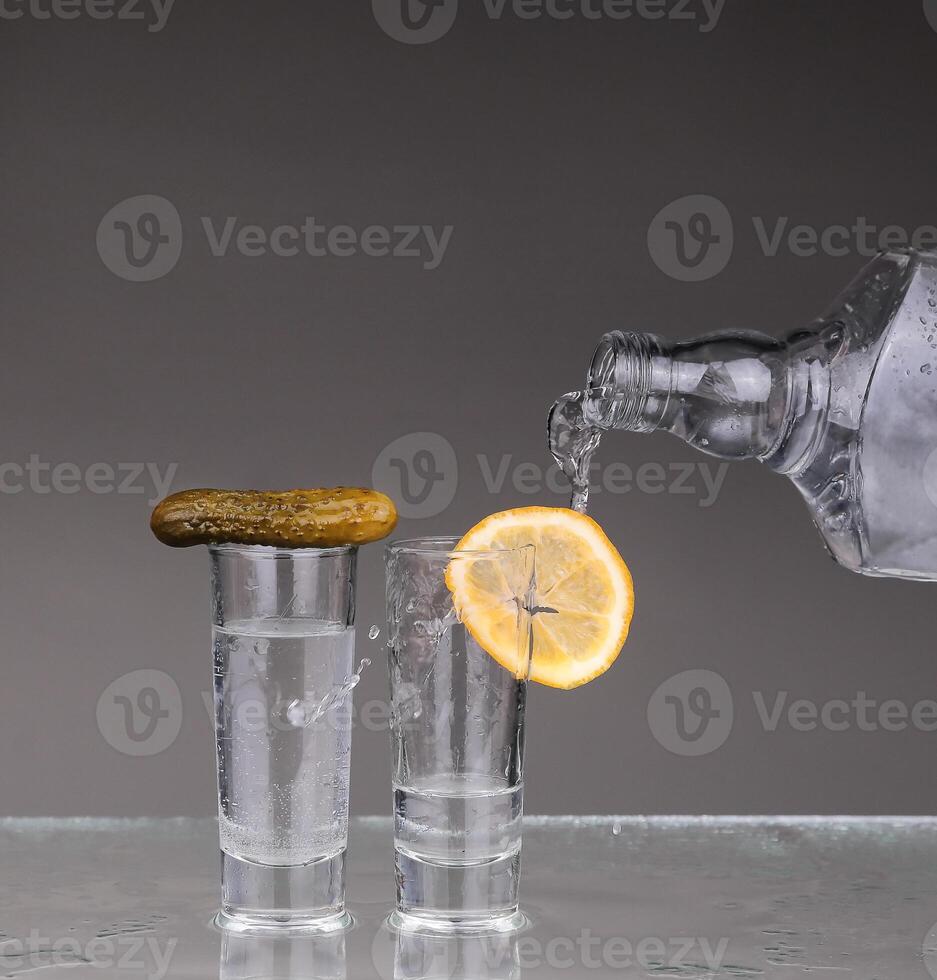 Vodka poured into a glass photo