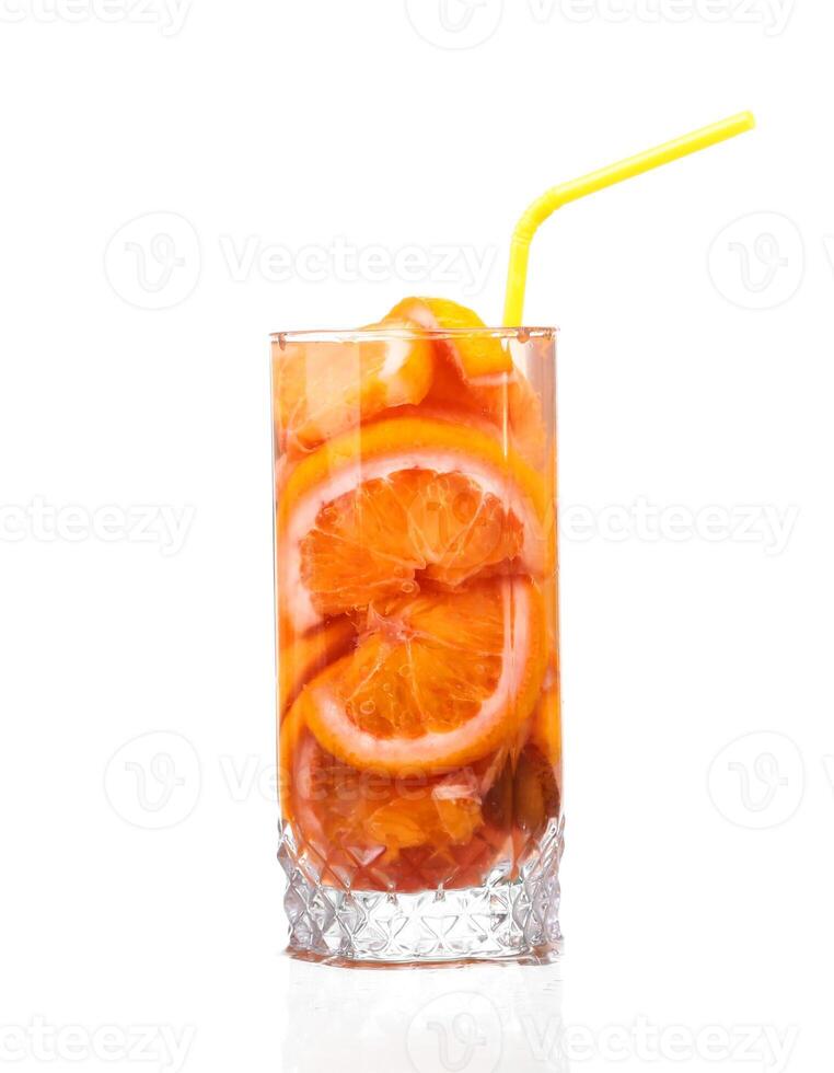 pitcher with a refreshing drink with lemon slices of orange and kiwi on white background photo