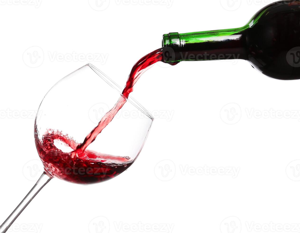 Red wine pouring on white background photo