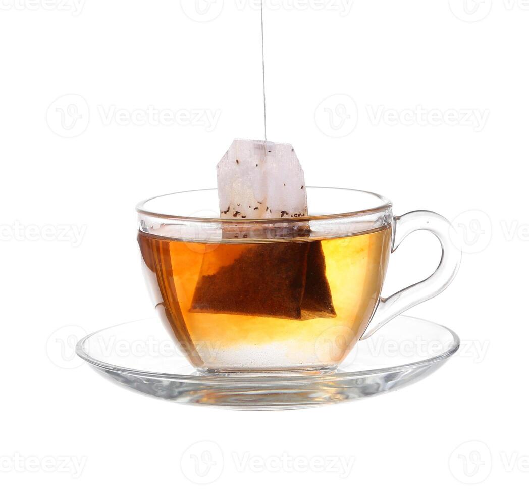 Glass of Tea with Bag End. Isolated on white background, with clipping path photo