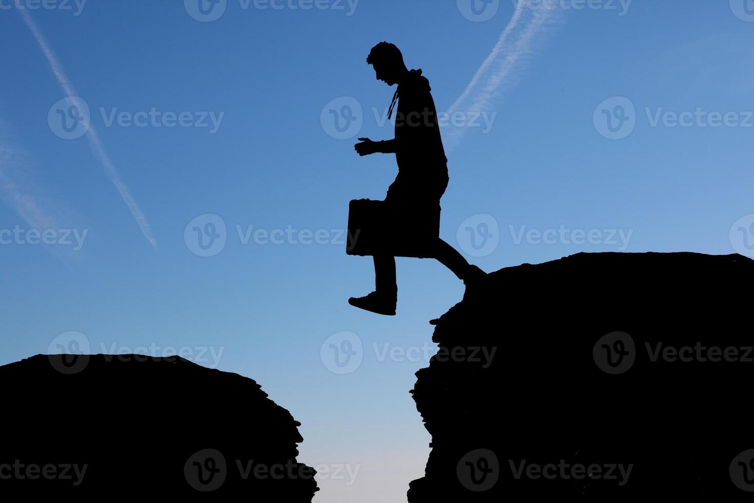 man at the top of the mountain photo