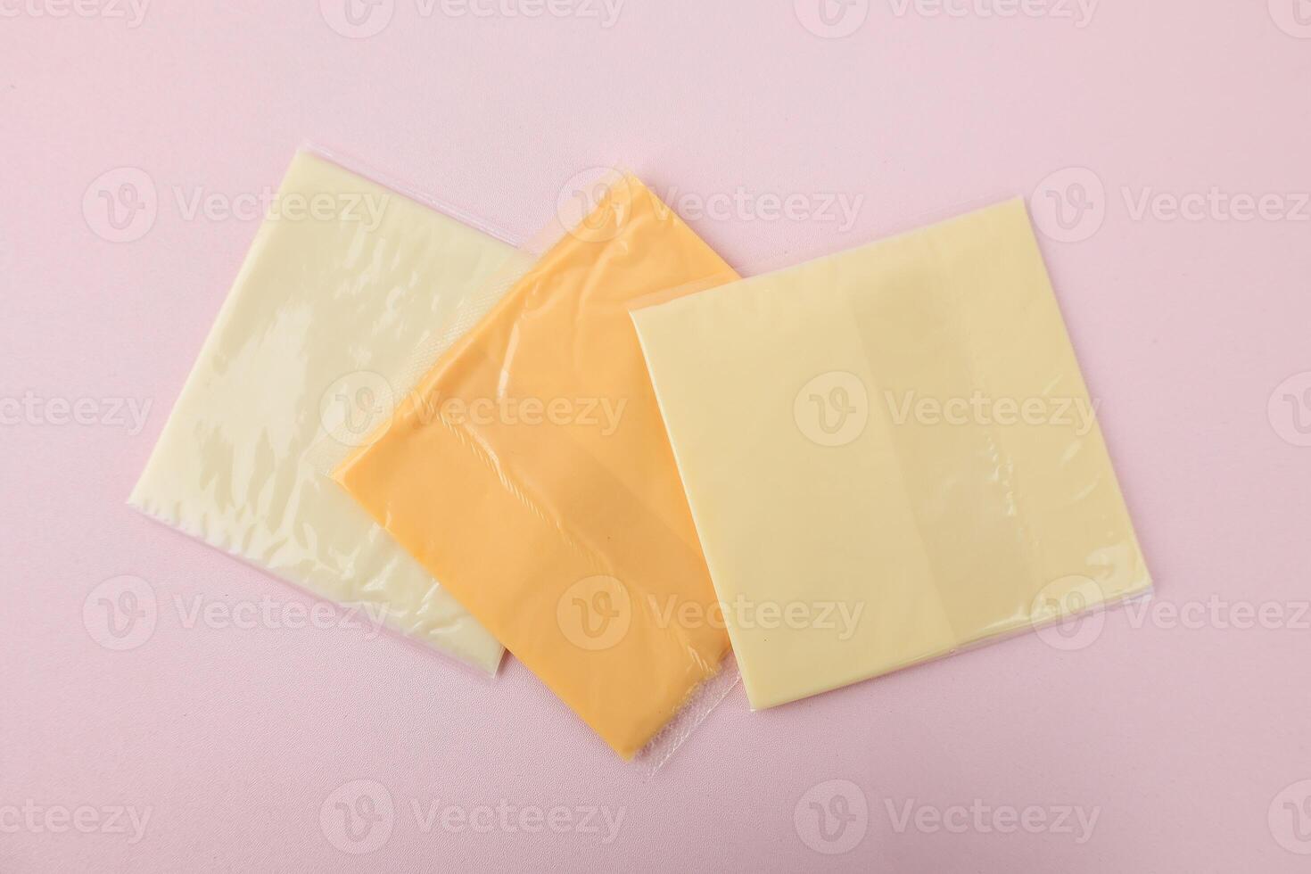 Top View Three Color Square Sliced Cheese with Plastic Individual Package photo