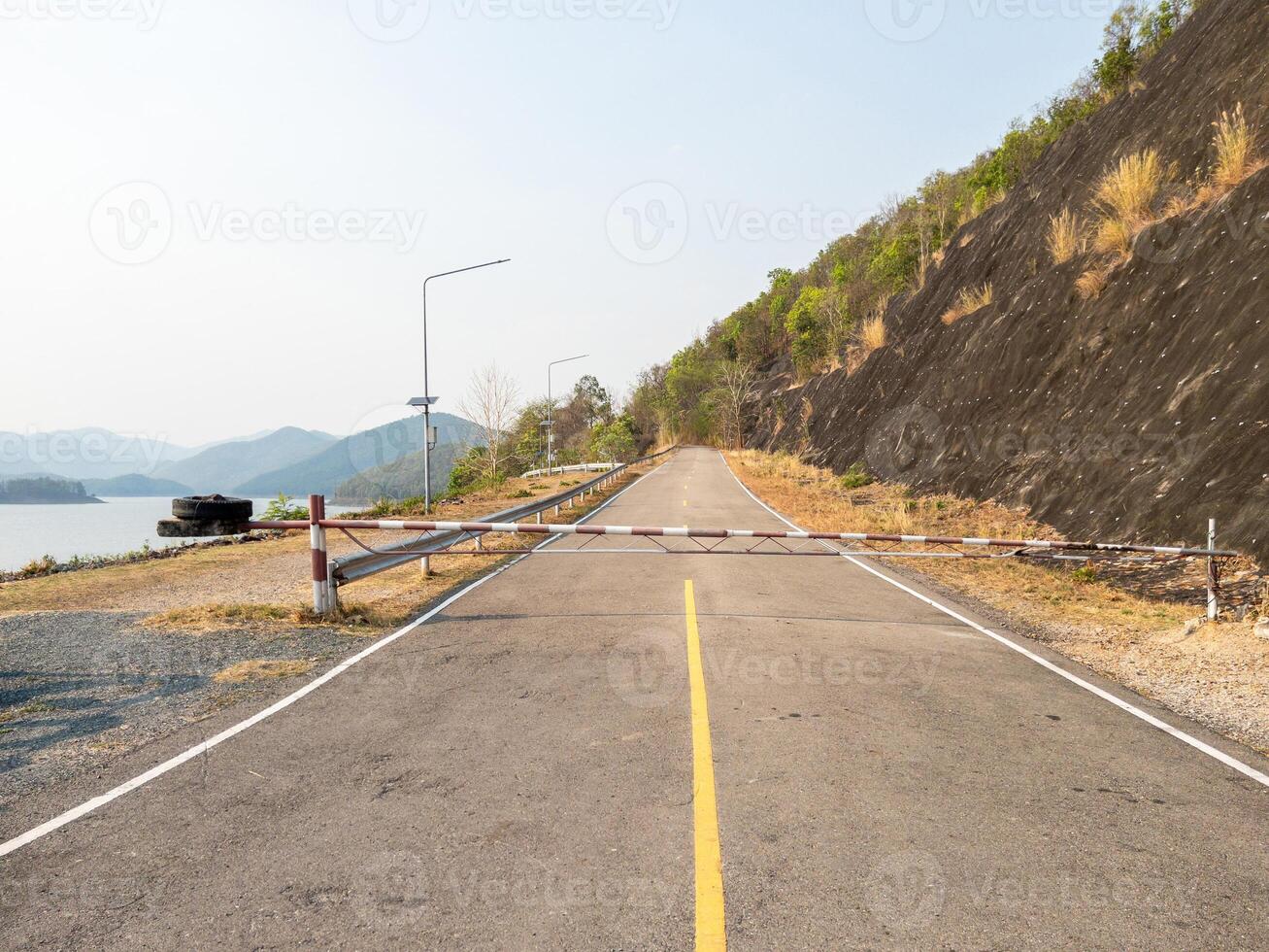 The metal barrier stands at the entrance to the hydroelectric power plant. photo
