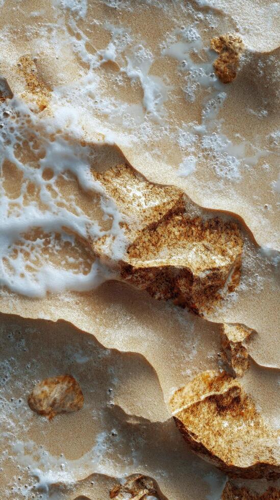 Smooth sandy texture with gentle water ripples reflecting natural patterns in a coastal setting photo