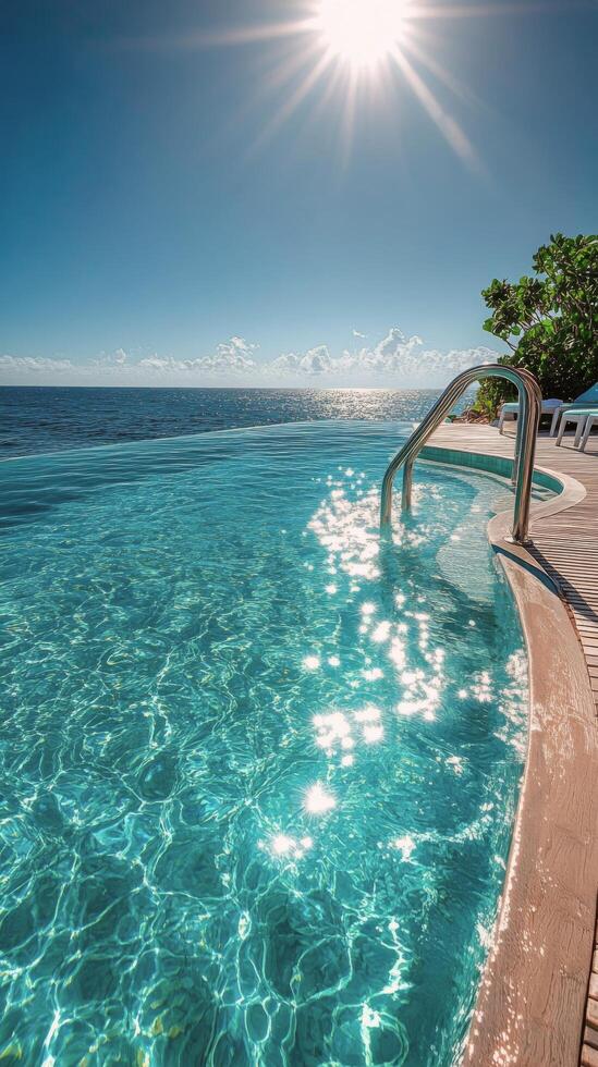Sunny afternoon by a sparkling pool at a tropical resort near the ocean photo