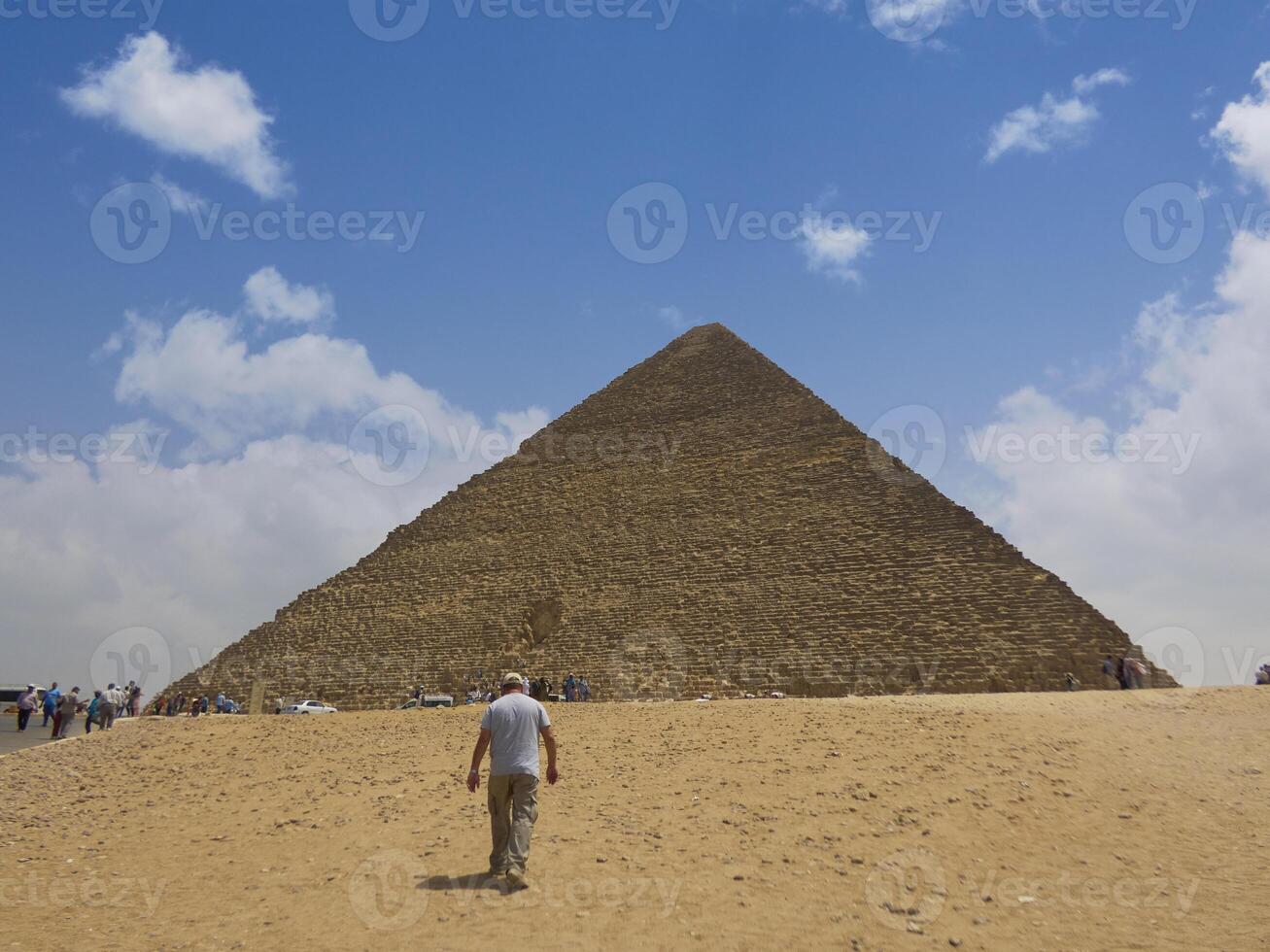 Egyptian pyramids in sand desert and clear sky photo