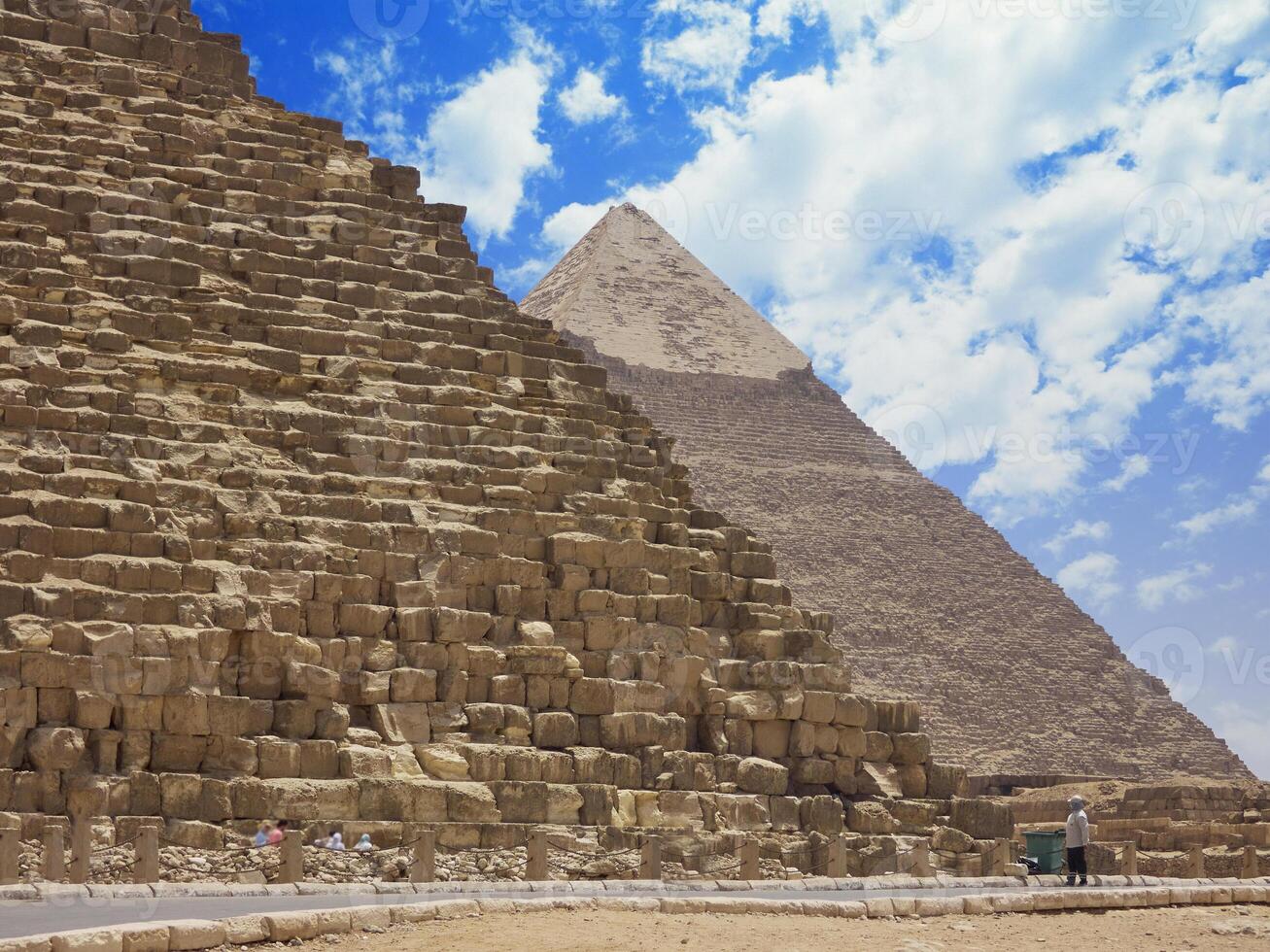 Egyptian pyramids in sand desert and clear sky photo