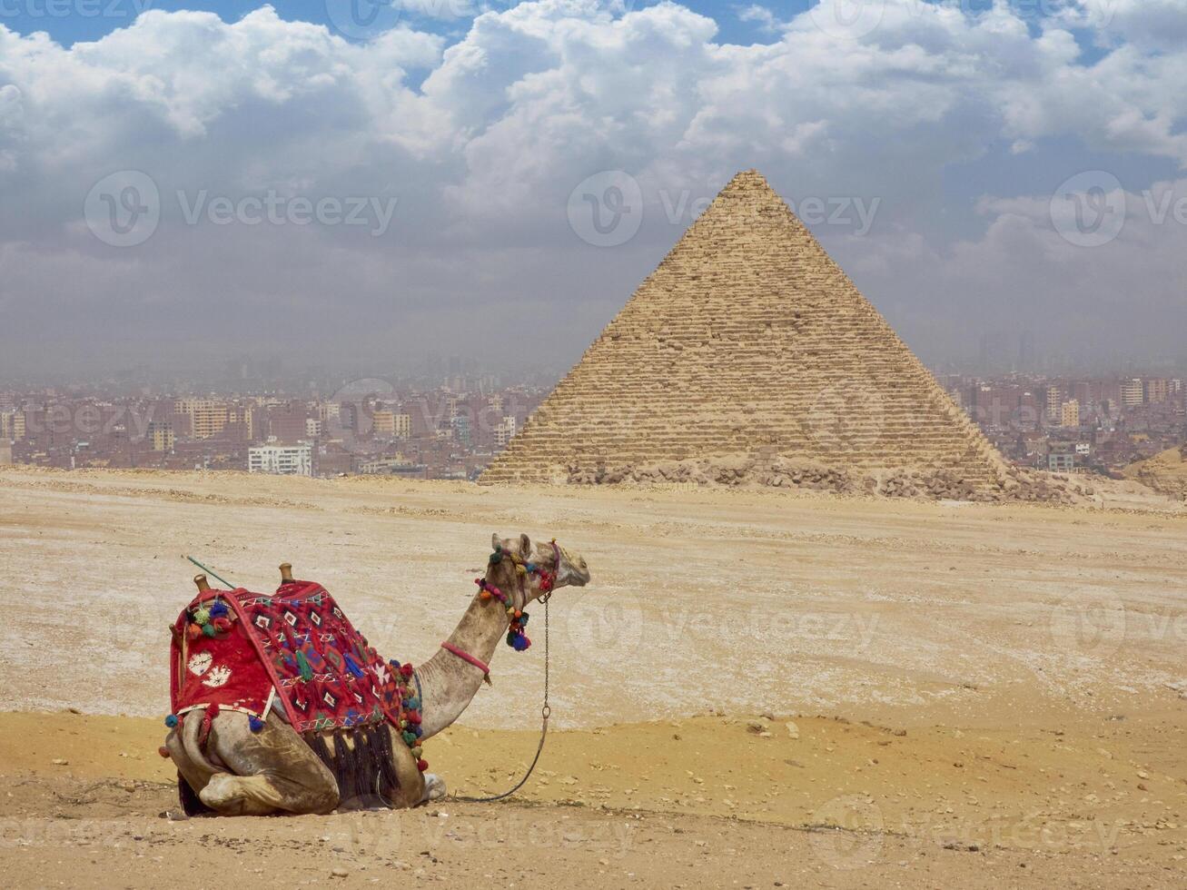 Egyptian pyramids in sand desert and clear sky photo