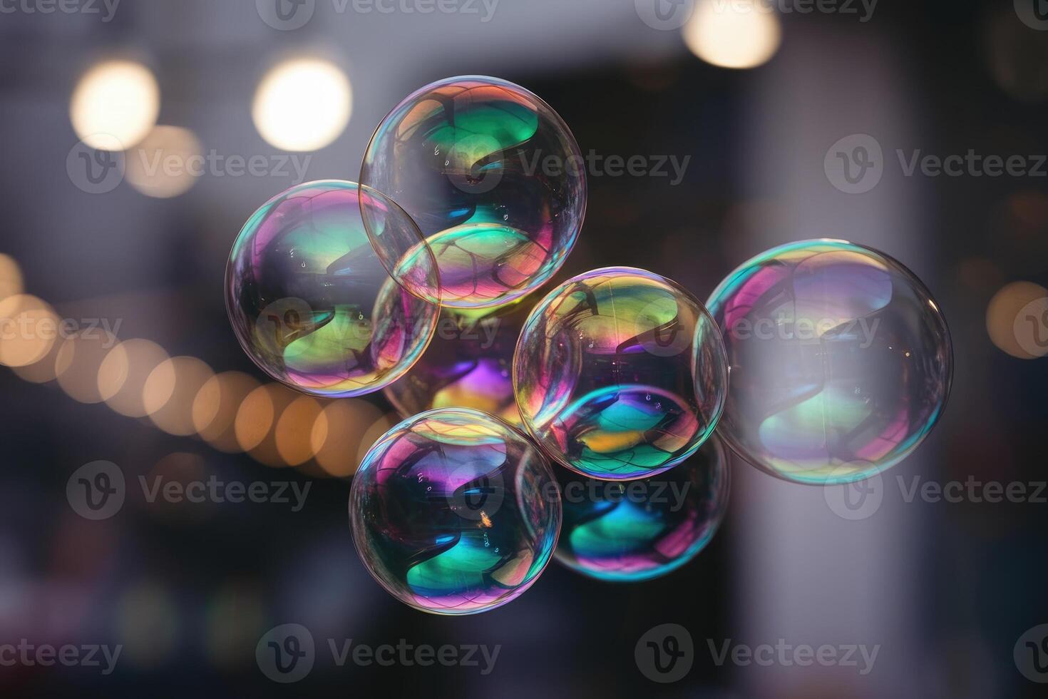 Group of soap bubbles floating showing iridescent colors with blurred background lights photo