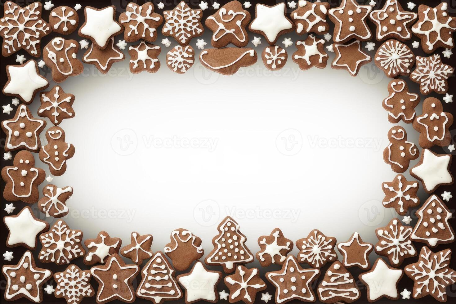 Christmas gingerbread cookies forming a frame on white background photo
