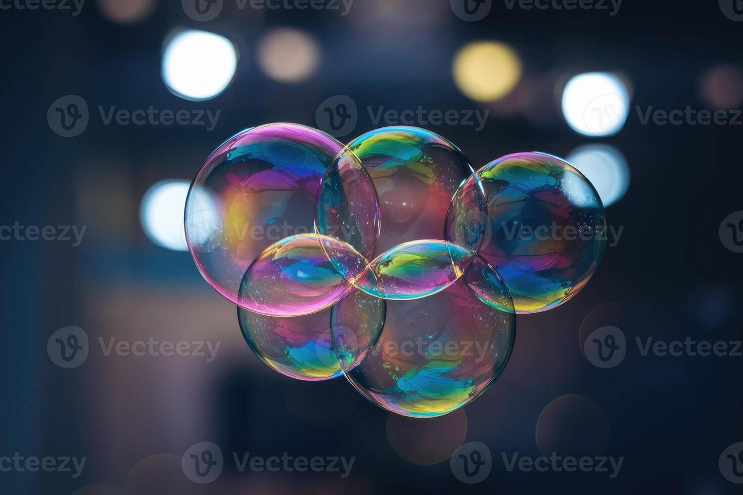 Group of soap bubbles floating showing iridescent colors with blurred background lights photo
