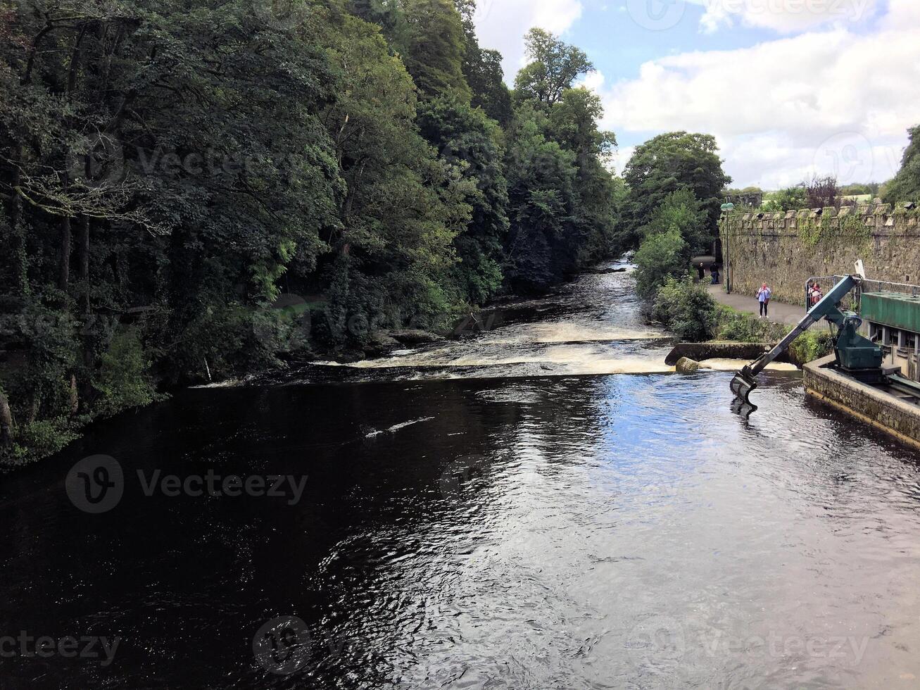 A river with a bridge over it photo