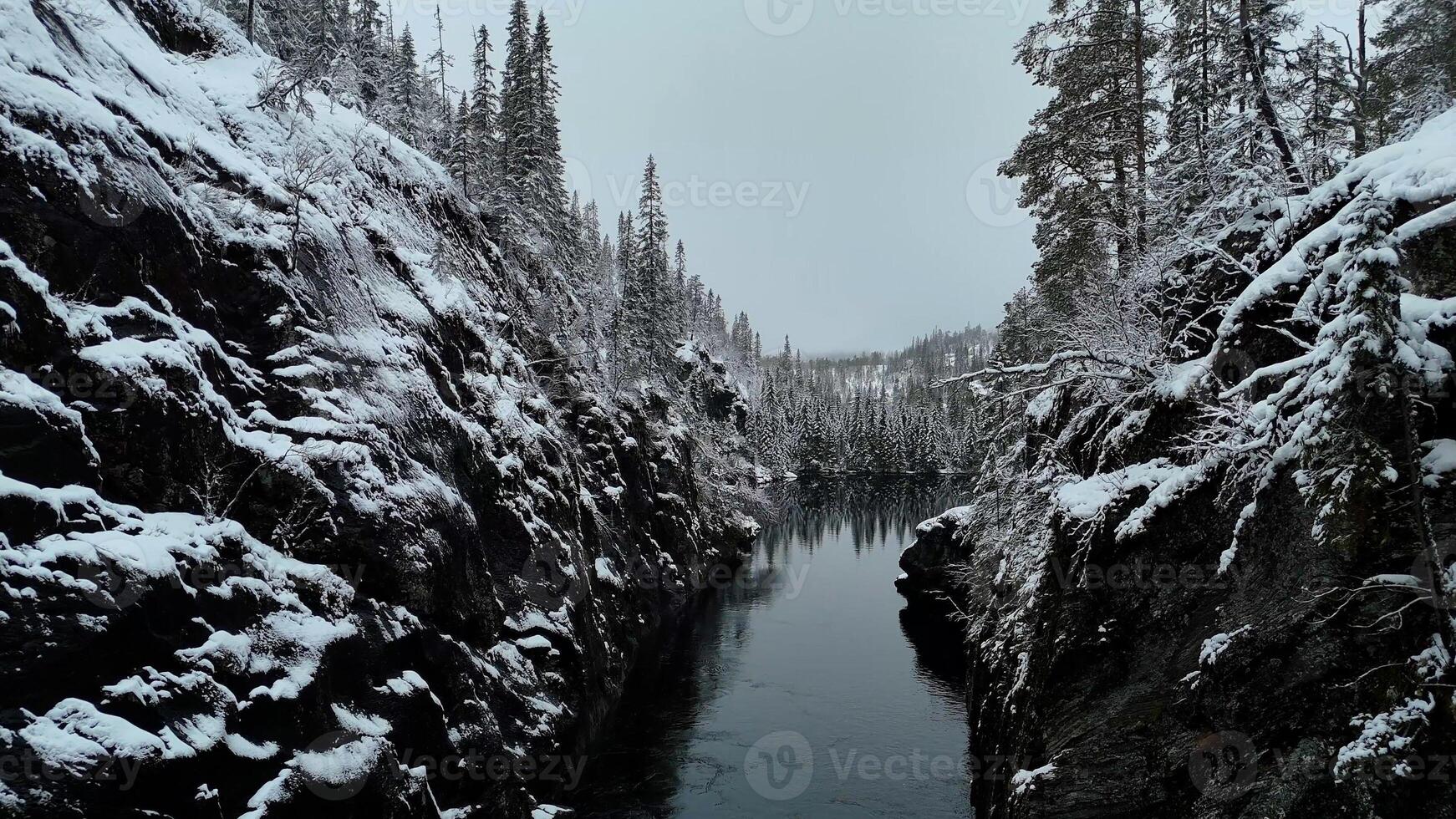 Aerial View of Winter Tunnel Over River in Northern Norways Snowy Beauty photo