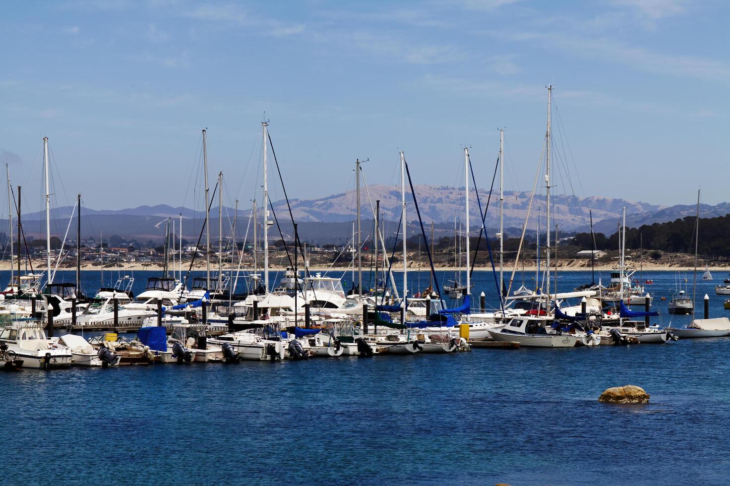 Monterey, CA, 2012 - Boats In Berths At Docks With Blue Water And Sky photo
