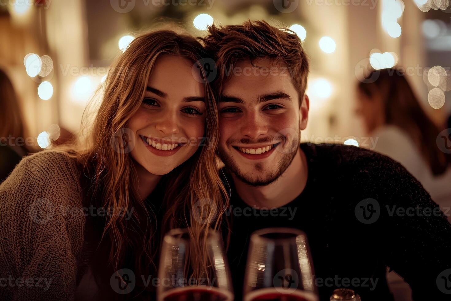 Romantic dinner with red wine against soft evening lights, a couple enjoying the moment. Perfect for restaurant ads and festive events. photo