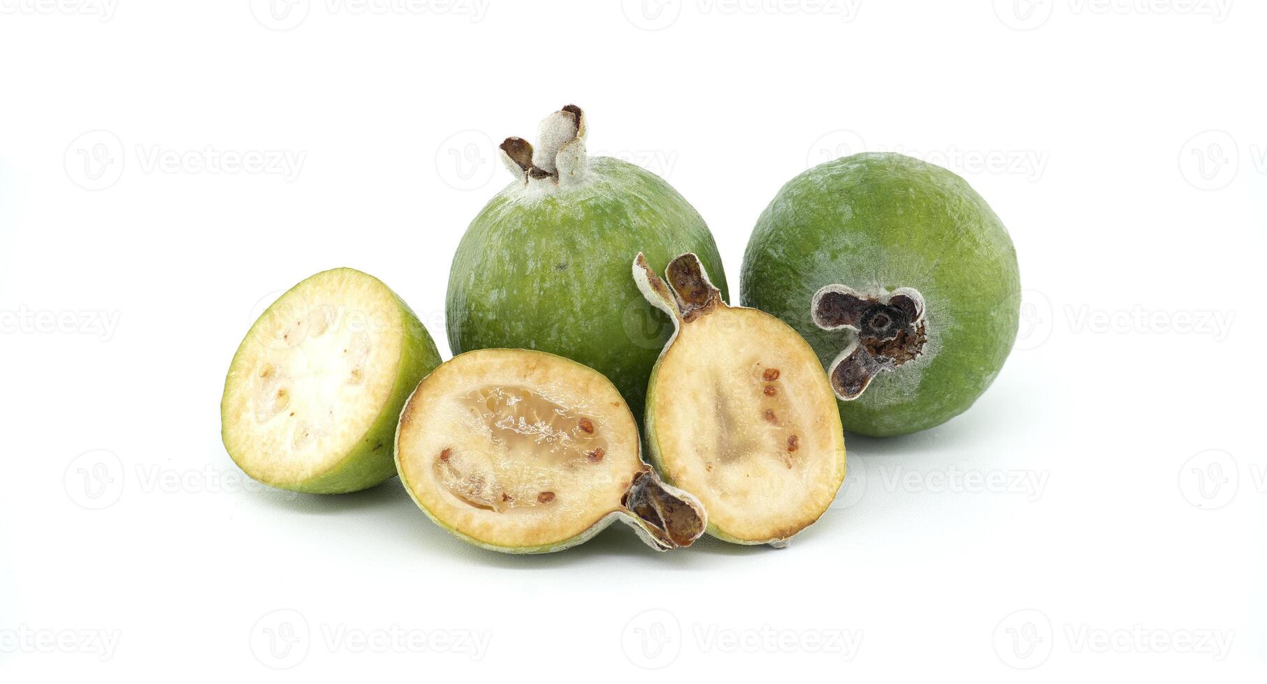 Fresh Green Feijoa Fruits with Sliced Halves on White Background photo