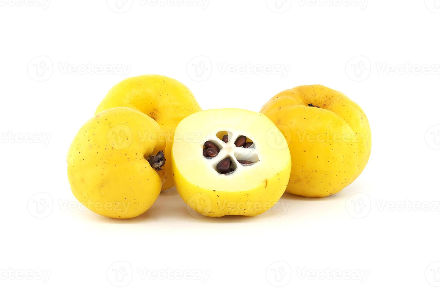 Japanese quince fruit in vibrant yellow, featuring whole and halved views isolated on white photo