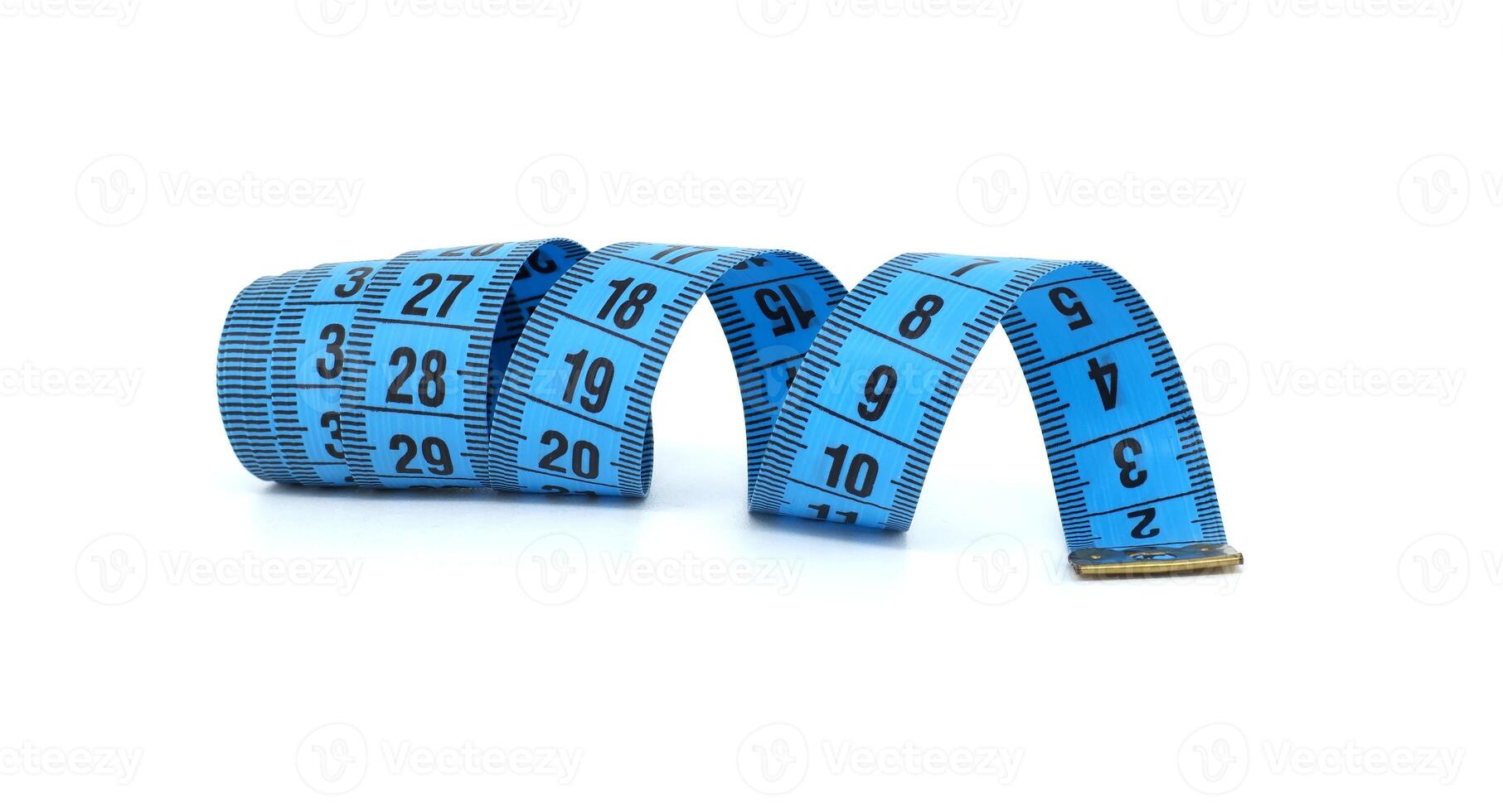 Blue Measuring Tape Rolled and Unrolled on White Background photo