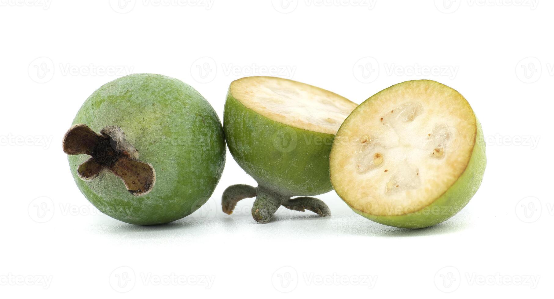 Close-Up of Fresh Whole and Sliced Feijoa Fruit on White Background photo