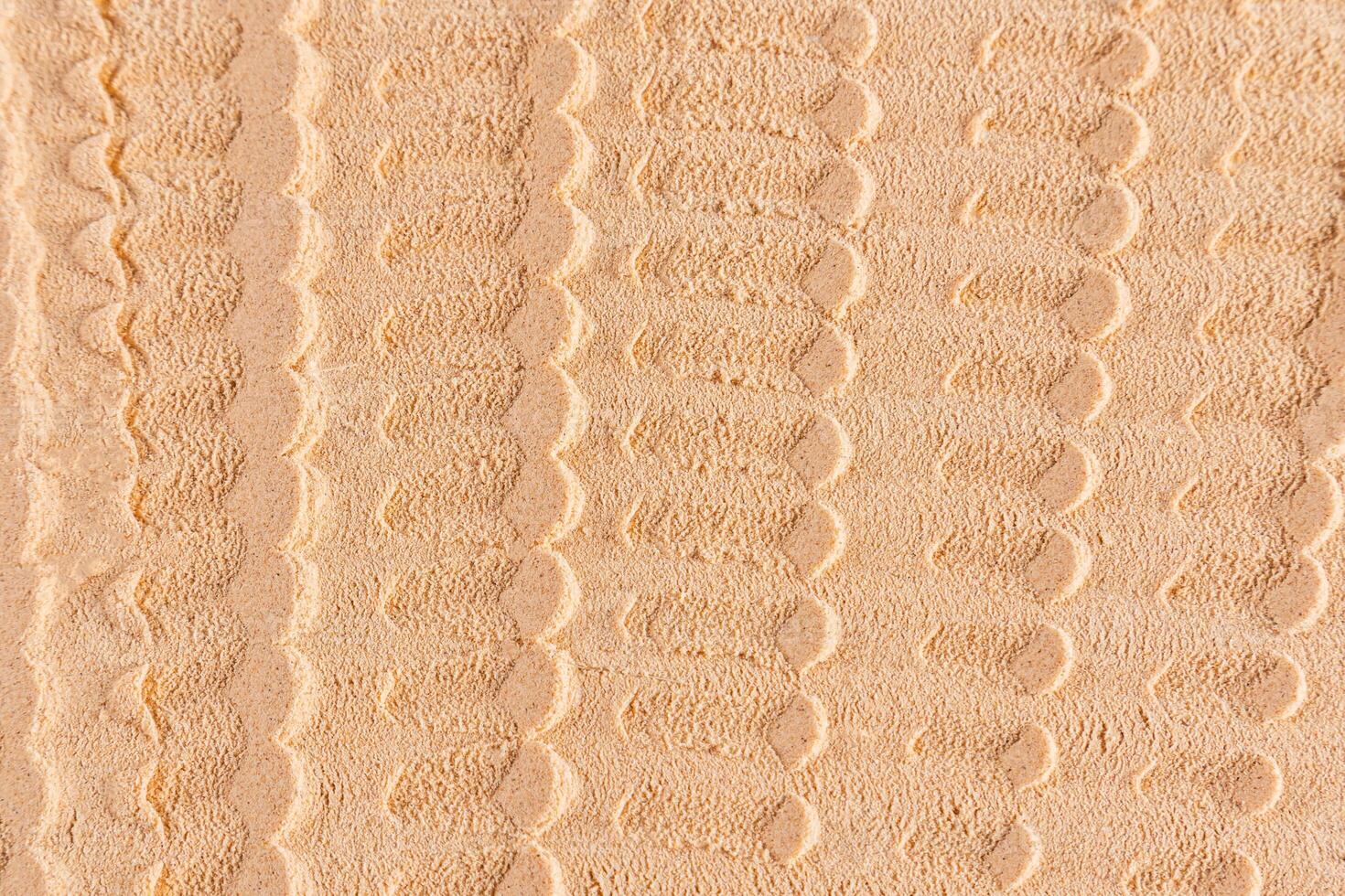 Chic cosmetic background texture of loose dry powder. beautiful lines of light tone powder texture. layout, design. Symmetrical Abstract Pattern. photo