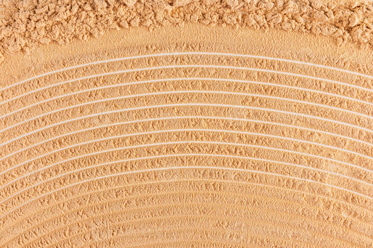 Beautiful texture of dry loose powder in a natural tone. cosmetic abstract background for design. top view. A copy space. layout. photo