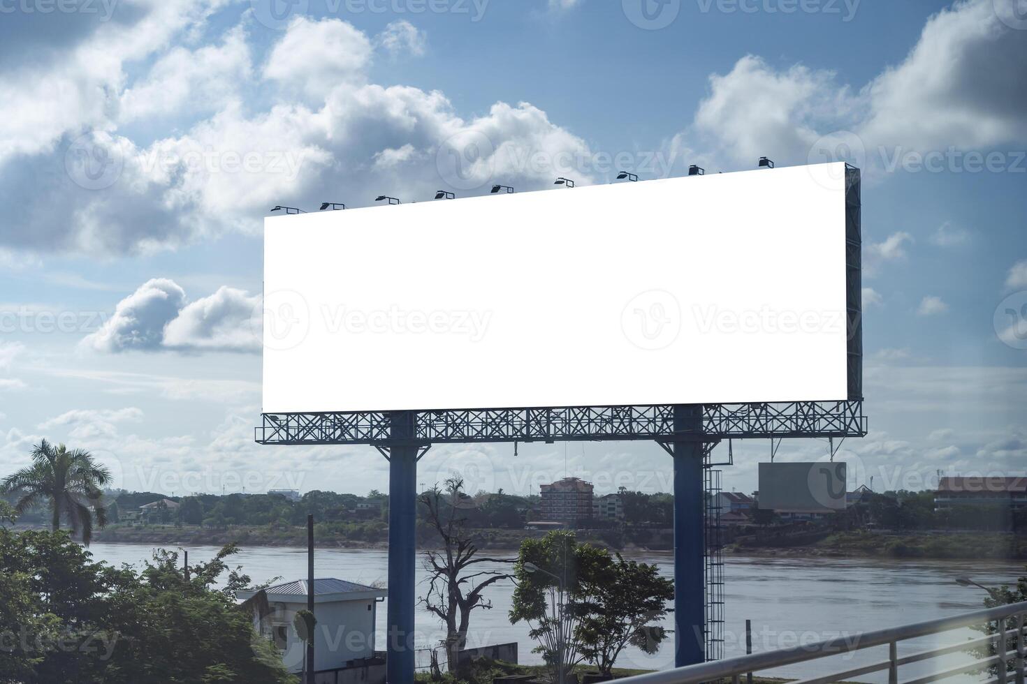 Blank billboard mockup on blue sky background for new advertisement. Mock up photo