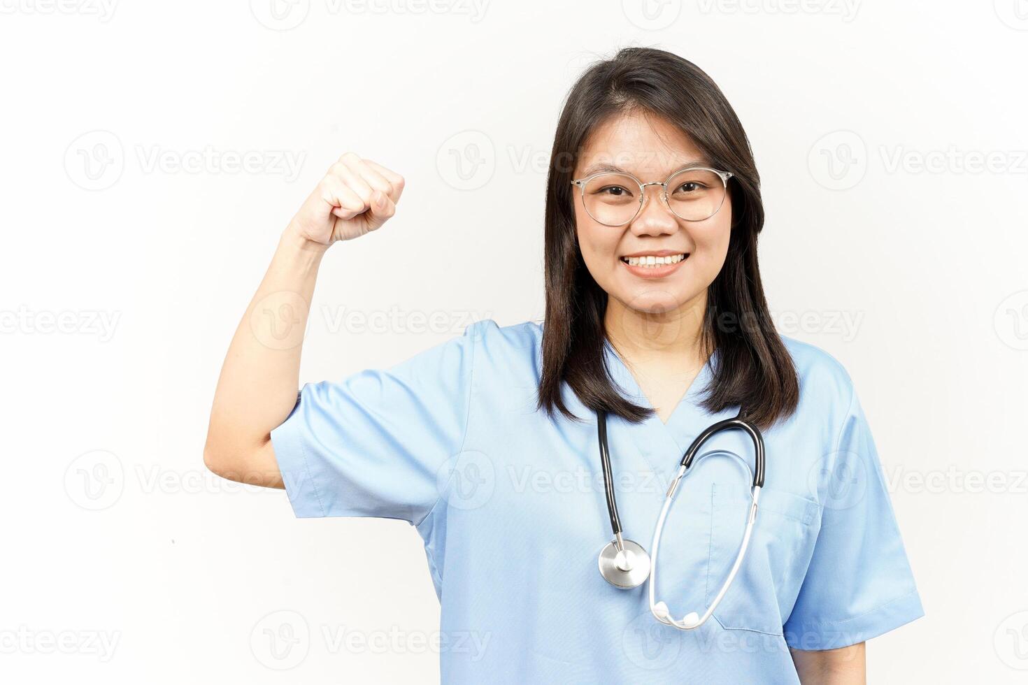 Showing Strength Arms Of Asian Young Doctor Isolated On White Background photo