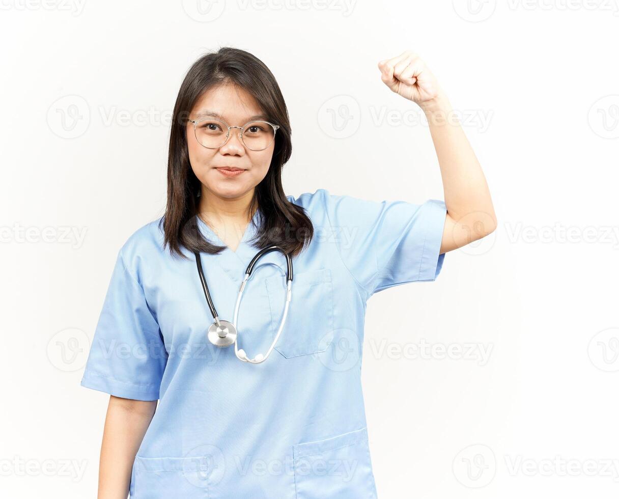Showing Strength Arms Of Asian Young Doctor Isolated On White Background photo