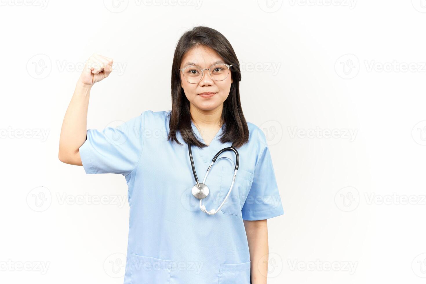 Showing Strength Arms Of Asian Young Doctor Isolated On White Background photo