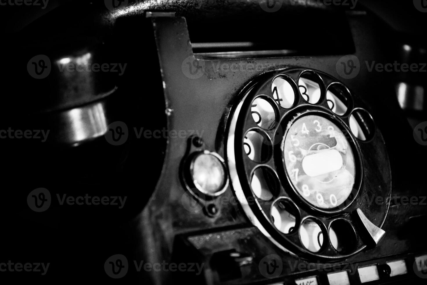 Old, retro and vintage landline rotary telephone in noir style photo