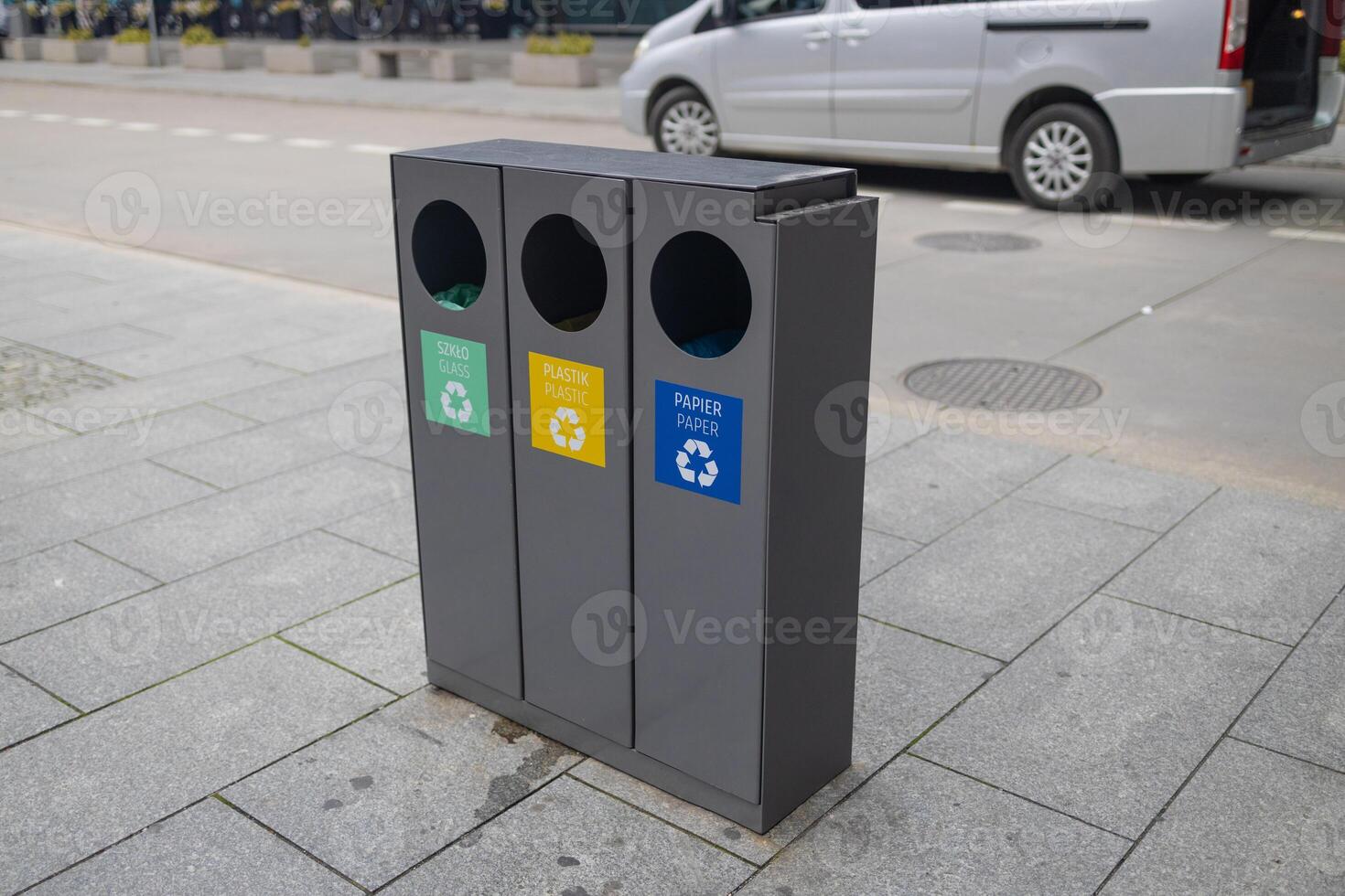 Four color trash cans , garbage bin in the park beside the walk way photo