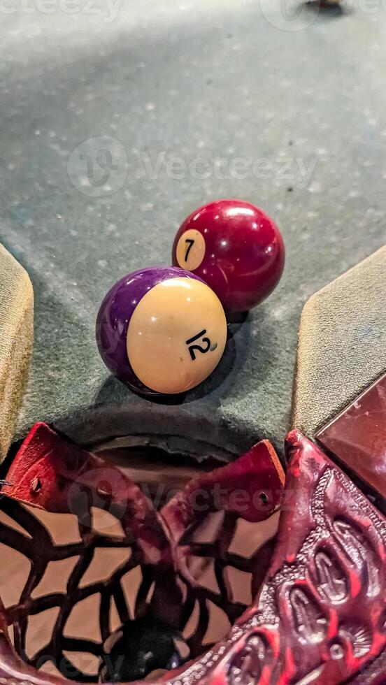 Billiard balls in front of a pocket. American billiards. Close-up. photo