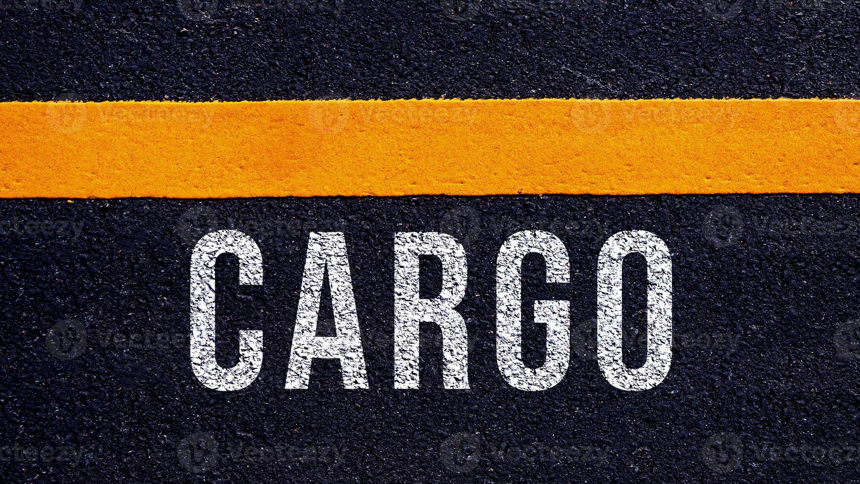 CARGO, cargo text written and yellow line on asphalt road ground. photo