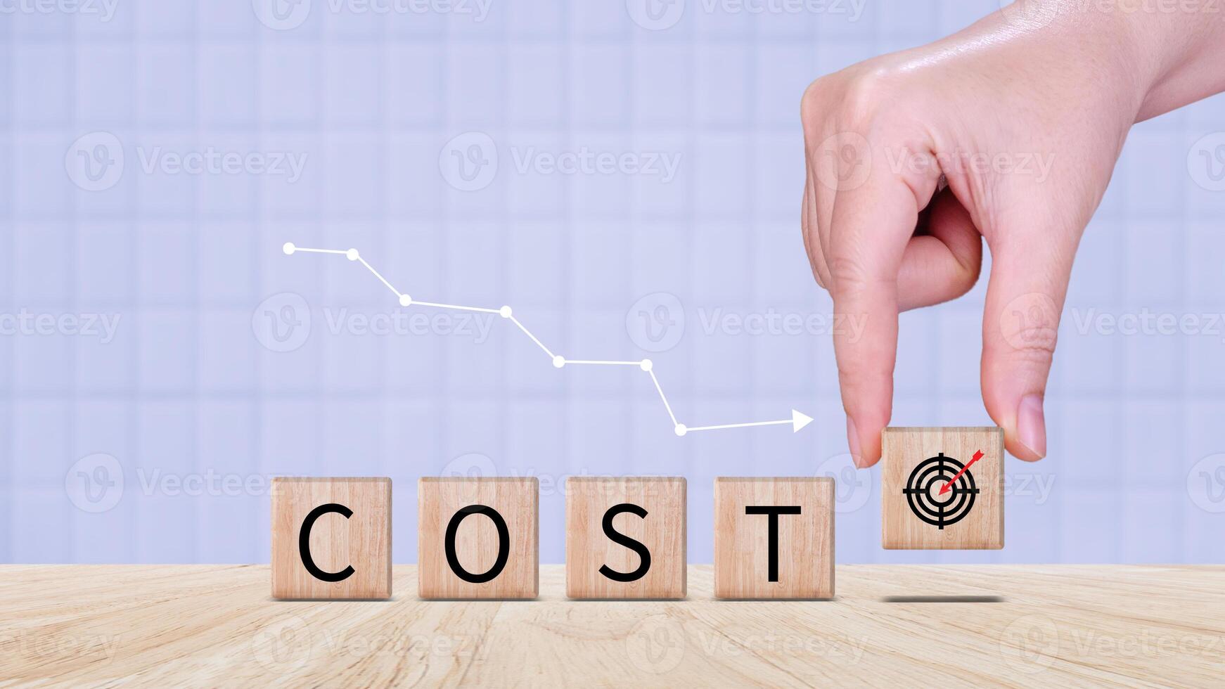Cost reduction concept on wooden cube, Expenses and saving money, Business strategy and project management, cost reduction, efficient business and budget cutting. photo
