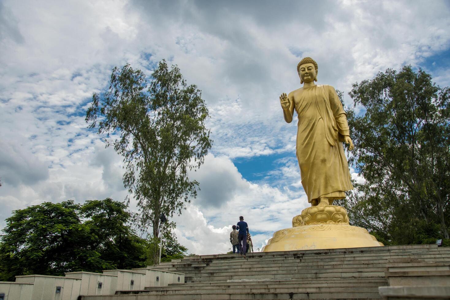 Tourists visit Giant Statue of Buddha at Nagaloka. Nagaloka is a Buddhist training and conference center located in Nagpur photo