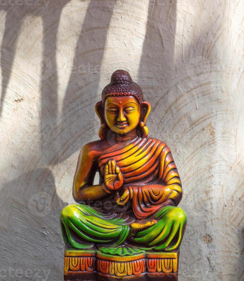 Statue of Buddha on abstract background photo
