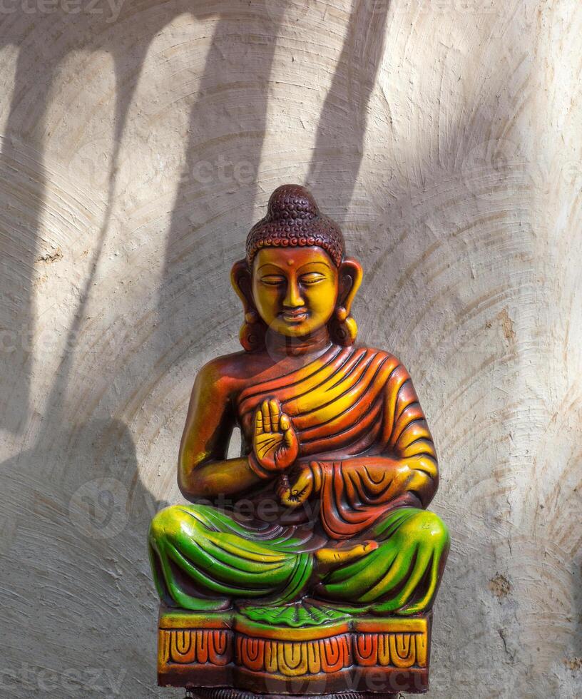 Statue of Buddha on abstract background photo