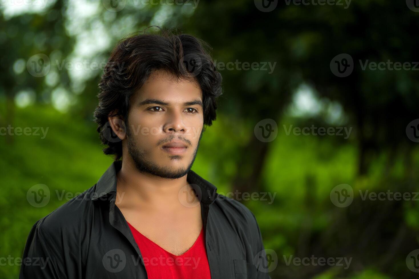 Handsome fashion young man posing outdoors photo