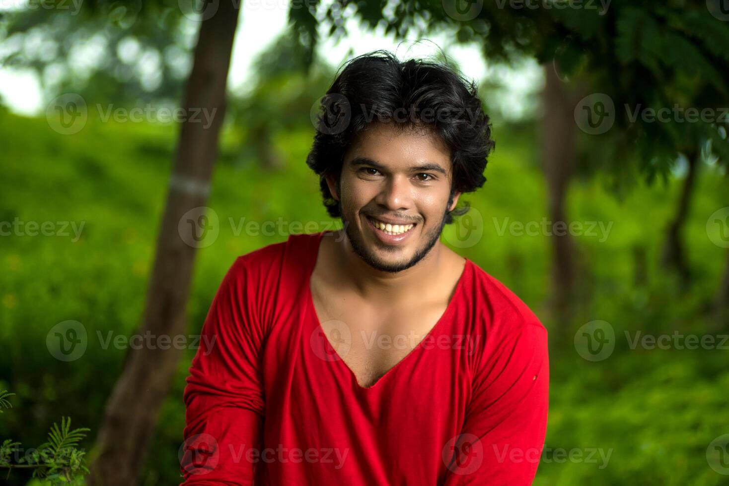 Handsome fashion young man posing outdoors photo