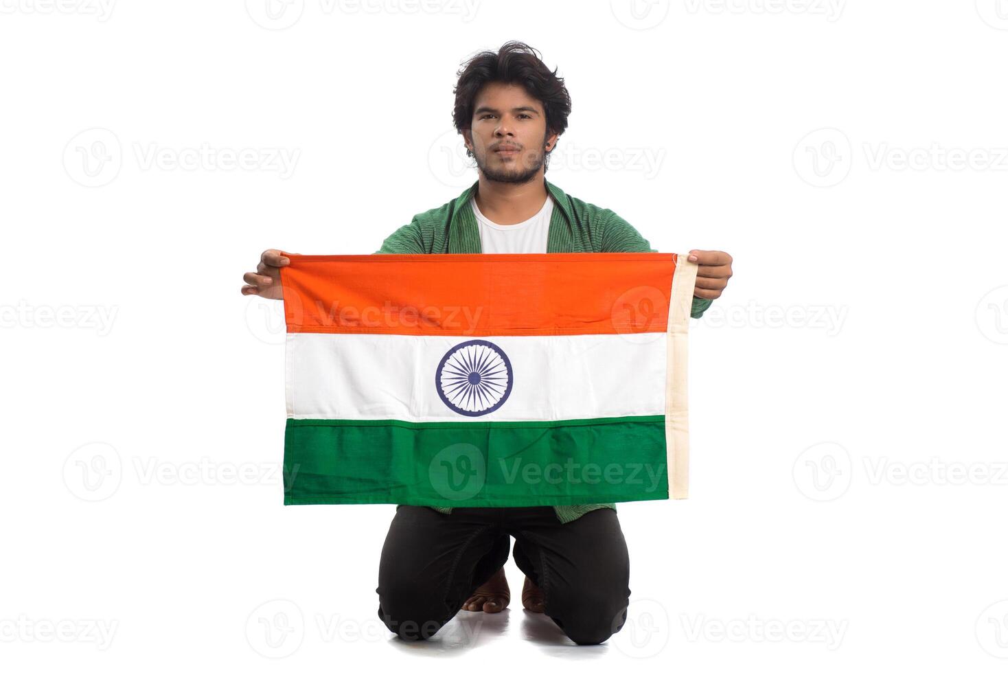Young man with Indian flag or tricolor on white background, Indian Independence day, Indian Republic day photo