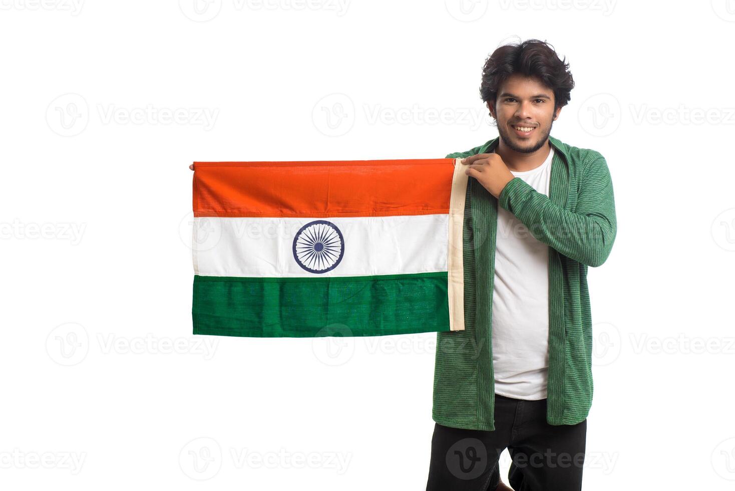 Young man with Indian flag or tricolor on white background, Indian Independence day, Indian Republic day photo
