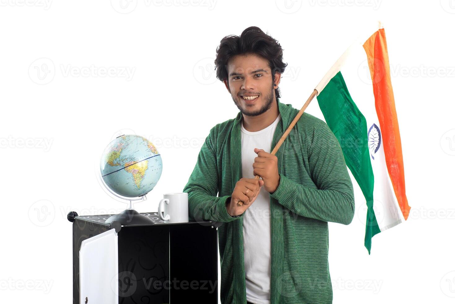 Young man with Indian flag or tricolor with world globe on white background, Indian Independence day, Indian Republic day photo