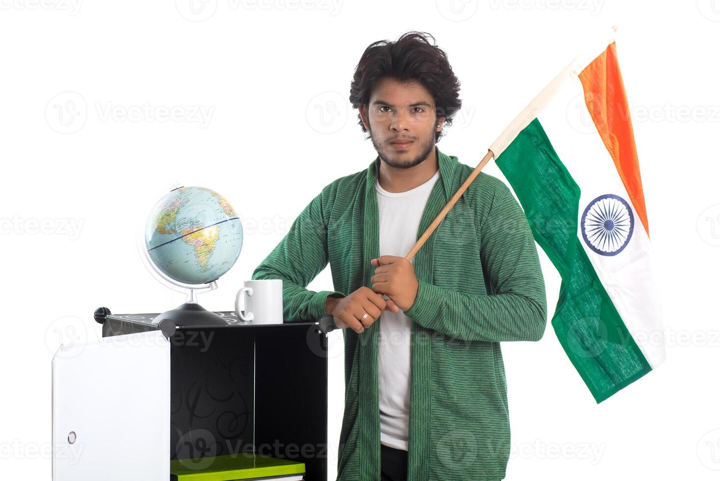 Young man with Indian flag or tricolor with world globe on white background, Indian Independence day, Indian Republic day photo
